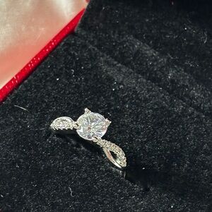 Sparkling Twist Moissanite Solitaire Ring in White Gold Tone